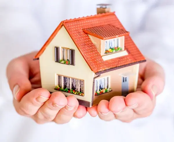 Depositphotos 73498747 stock photo house in human hands
